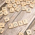Scrabble tiles spelling the word “post,”